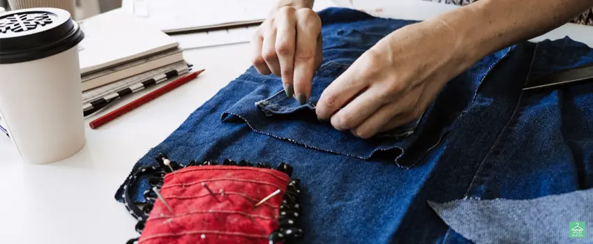HHTS-Woman upcycling an old pair of denim jeans