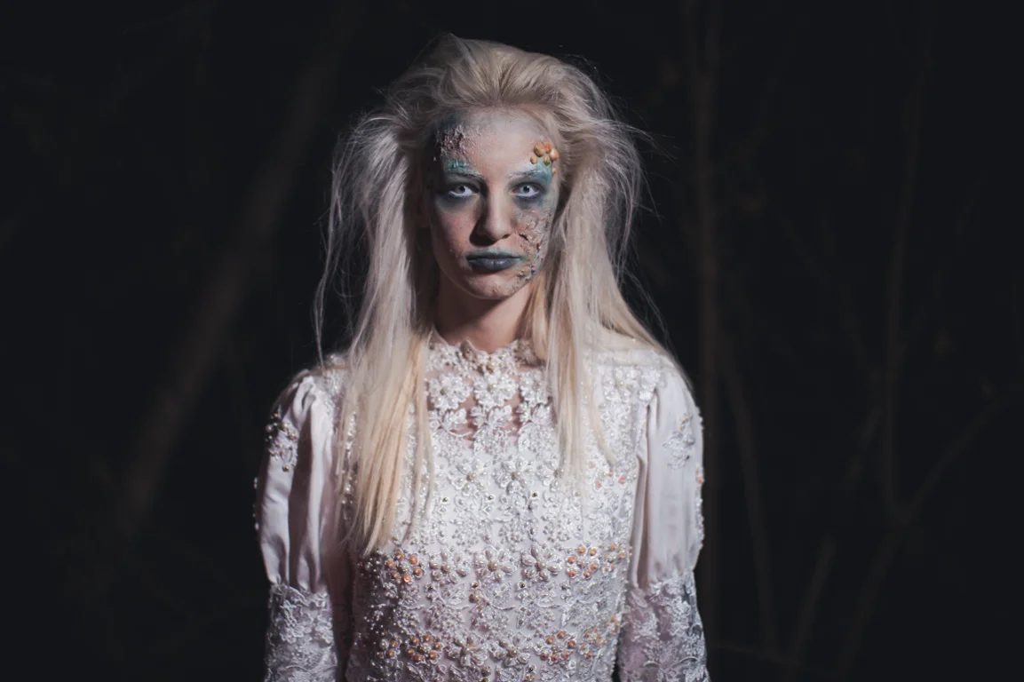 A zombie woman wearing white dress